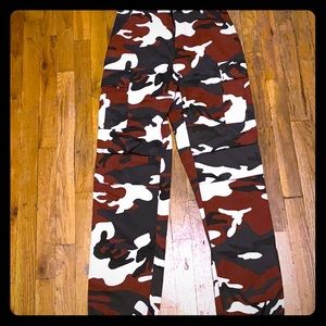 Red, black, olive green, and white camo pants